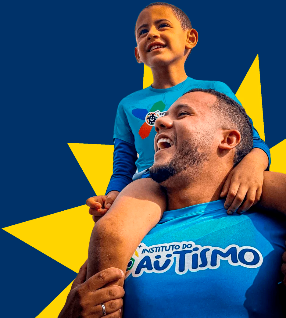 Criança autista e cuidador do Instituto do Autismo